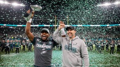 jalen hurts and nick sirianni hoisting the george halas trophy - Image generated by AI for representational purposes.