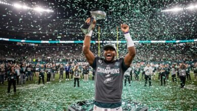 jalen hurts holding the george halas trophy - Image generated by AI for representational purposes.